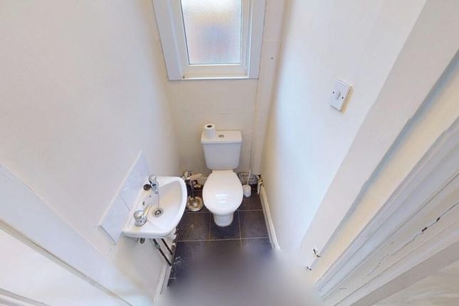A Clean And Well-Maintained Small Toilet Space Wit...