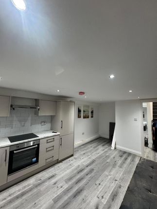 Modern Kitchen Area With Sleek Grey Cabinetry, Bui...