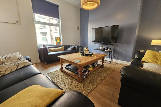 A Cozy And Stylish Living Room Featuring Comfortab...