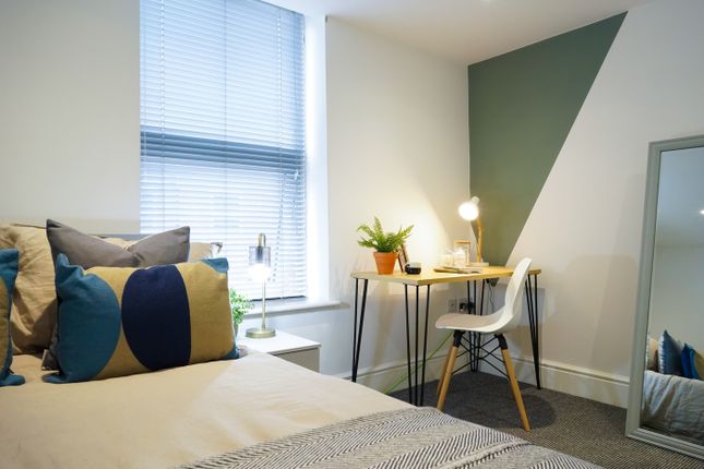 A Bright And Inviting Double Bedroom Featuring A S...