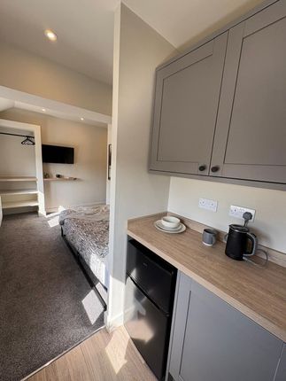 A Bright And Tidy Single Bedroom With Contemporary...