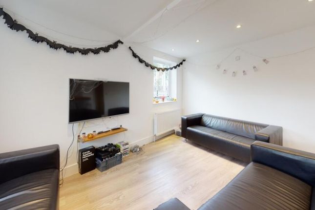 Bright And Inviting Living Room Featuring Modern F...