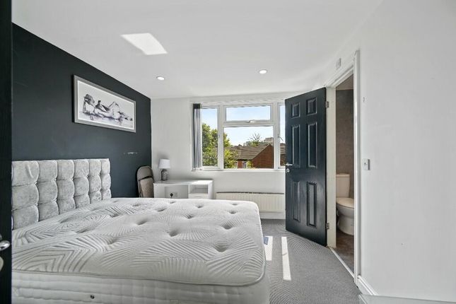 Bright And Airy Master Bedroom Featuring A Large W...