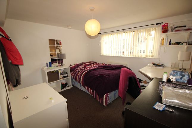 Cozy Single Bedroom Featuring A Comfortable Bed Wi...