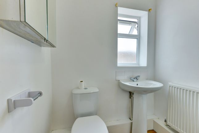 A Bright And Clean Bathroom Featuring A WC And A S...