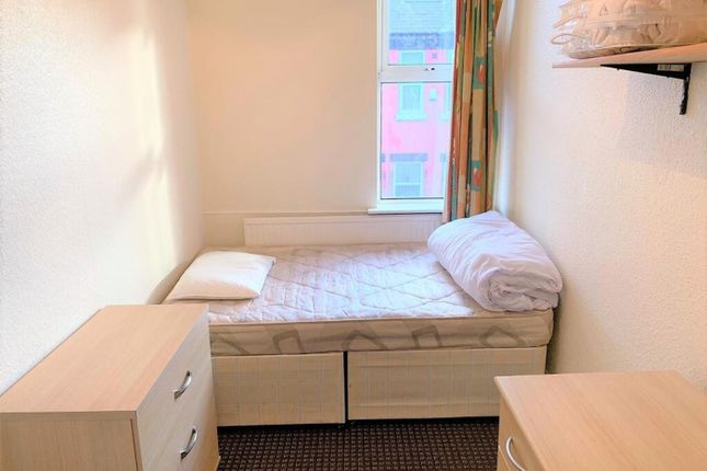 This Cozy Single Bedroom Offers A Bright Atmospher...
