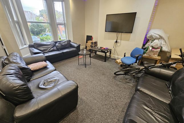 A Spacious And Well-Maintained Living Room Featuri...