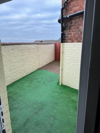 A Private Outdoor Garden Area With Clean Artificia...