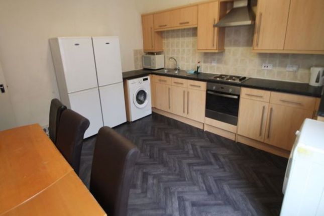 A Well-Maintained Kitchen Featuring Ample Cabinetr...