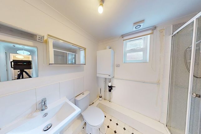 A Bright And Clean Bathroom Featuring Modern Fixtu...
