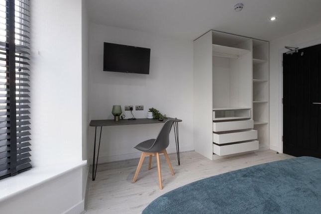 Bright, Modern Bedroom With Light Wood Floors, A W...