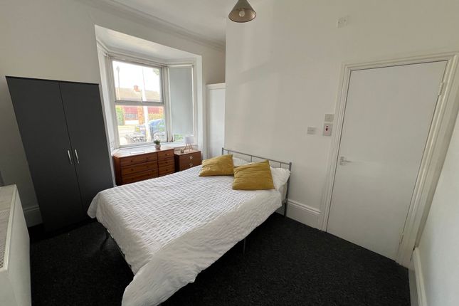 A Bright Double Bedroom Featuring A Comfortable Do...