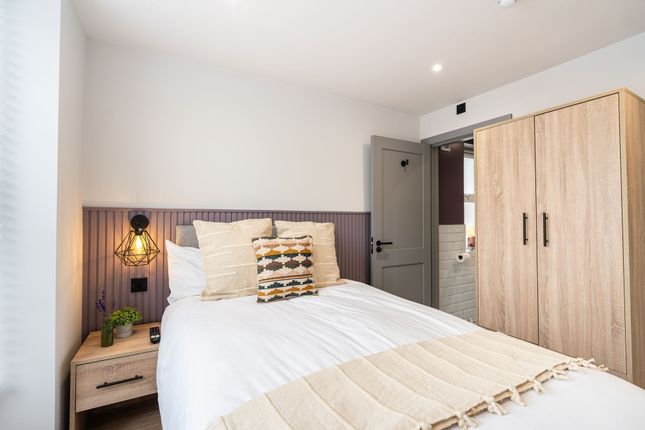 A Cozy And Well-Decorated Double Bedroom Featuring...