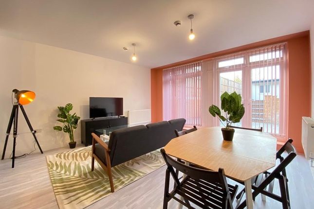 Bright And Modern Living Room Featuring A Comforta...