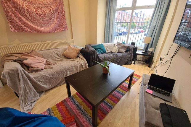 Bright And Welcoming Living Room Featuring A Large...