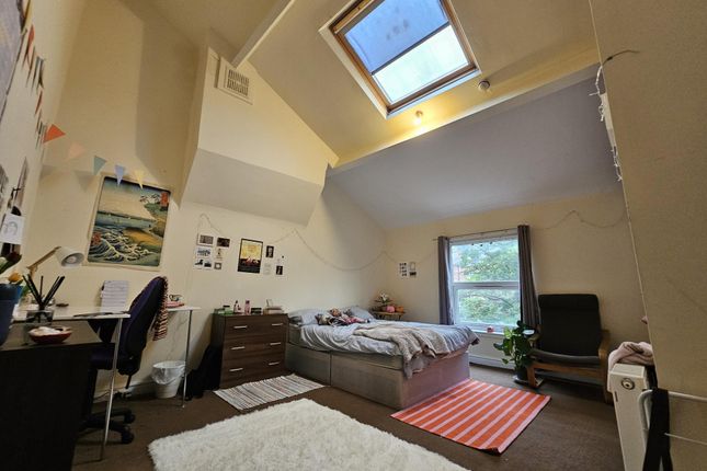 A Cozy And Well-Lit Student Bedroom Featuring A Si...