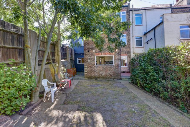 A Spacious And Sunny Paved Garden Area With Mature...