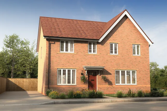 Property 1 of 9. A Modern Brick House With A Red Door Stands On A Paved Driveway In Front Of A Lush Green Background