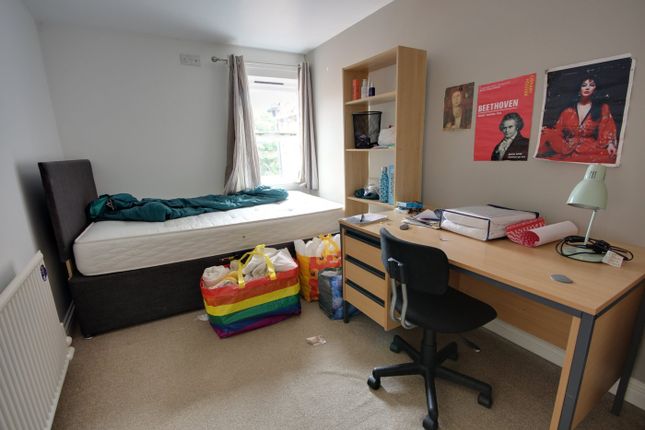 A Cozy Double Bedroom Featuring A Comfortable Bed ...