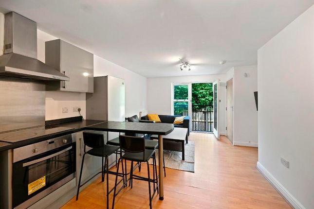 A Modern Kitchen And Dining Area Featuring Sleek c...