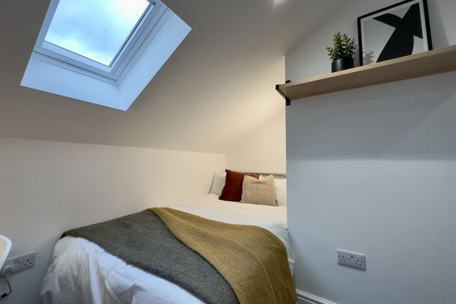 A Bright And Cozy Double Bedroom Featuring Stylish...