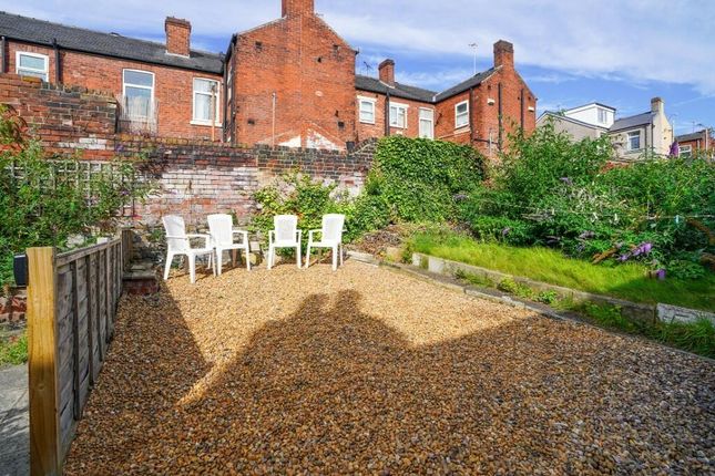 A Sunny, Spacious Garden With A Gravel Seating Are...