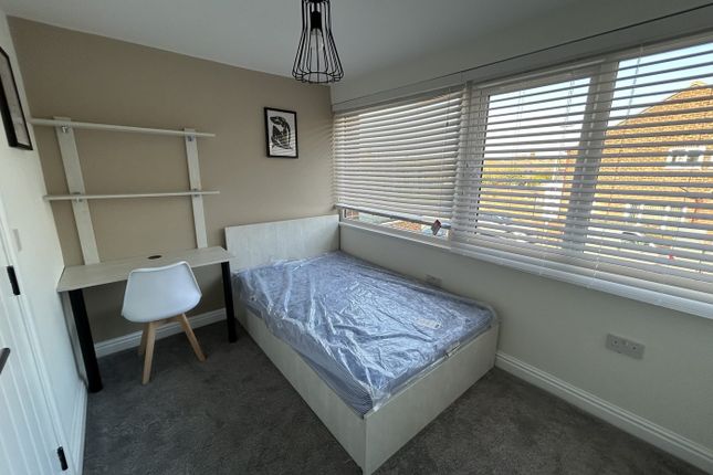 A Bright And Tidy Double Bedroom Featuring A Comfo...