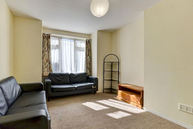 Bright And Welcoming Living Room Featuring Comfort...