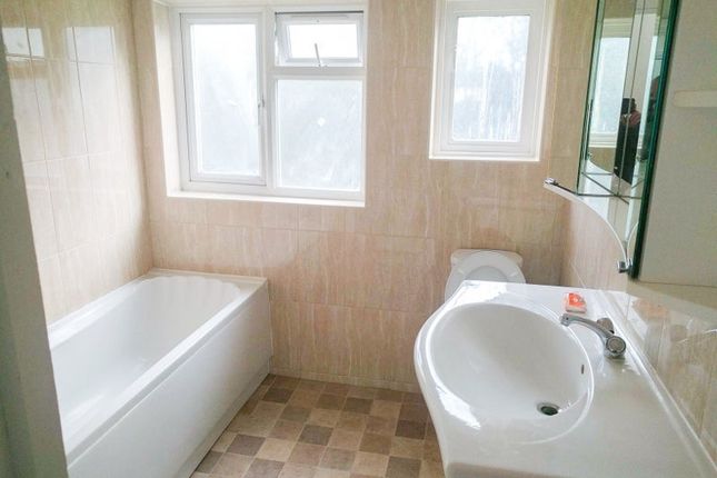 Bright And Clean Bathroom Suite Featuring A Modern...