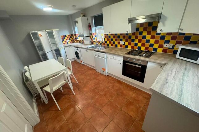 Bright And Spacious Kitchen Featuring Modern Appli...