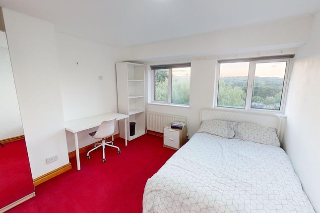A Bright And Inviting Double Bedroom With Modern F...
