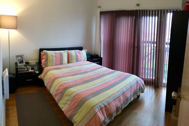 A Bright And Well-Kept Master Bedroom Featuring A ...