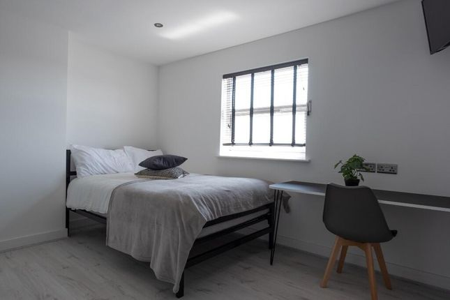 A Bright And Inviting Double Bedroom Featuring A c...