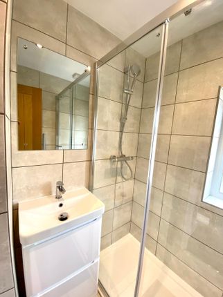 A Modern And Clean Bathroom Featuring A Spacious S...