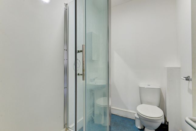 A Clean And Modern Single Toilet Room Featuring A ...