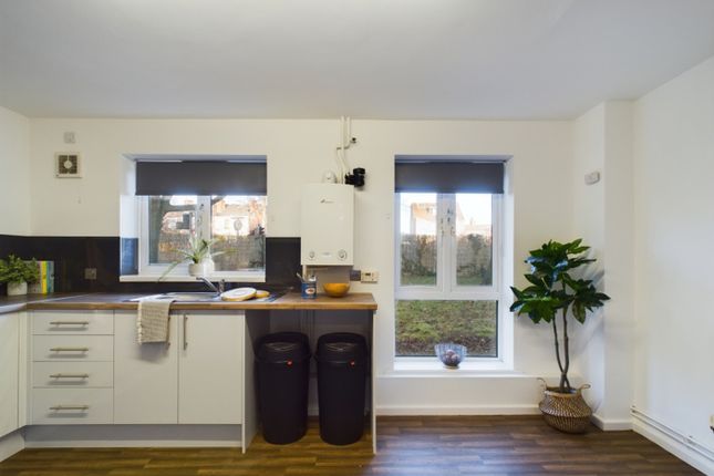 A Bright And Modern Kitchenette With Ample Storage...