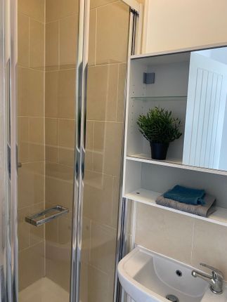 A Modern Bathroom Featuring A Sleek Shower, Elegan...