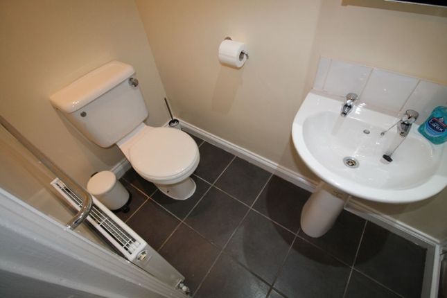 A Tidy And Well-Maintained Single Toilet Featuring...