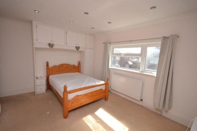 A Cozy Double Bedroom Featuring Ample Natural Ligh...