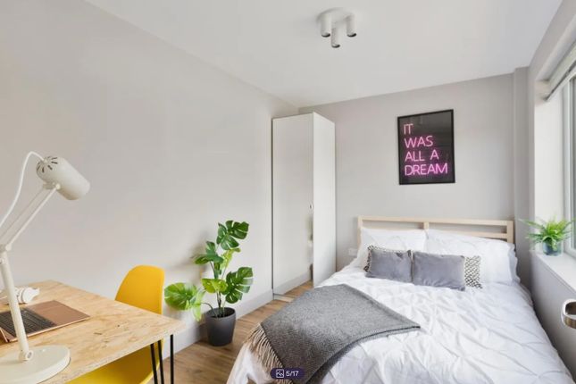 A Bright And Inviting Double Bedroom Featuring Mod...