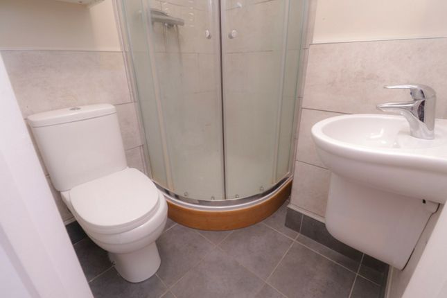 A Modern And Clean Bathroom Featuring A Spacious S...
