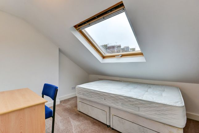 A Cozy Bedroom Featuring A Comfortable Double Bed ...