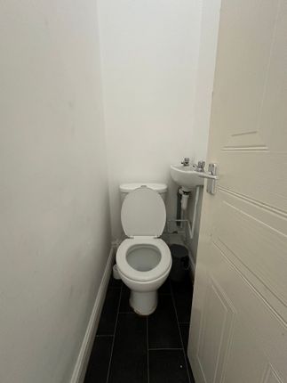Compact And Functional Single Toilet Room Featurin...
