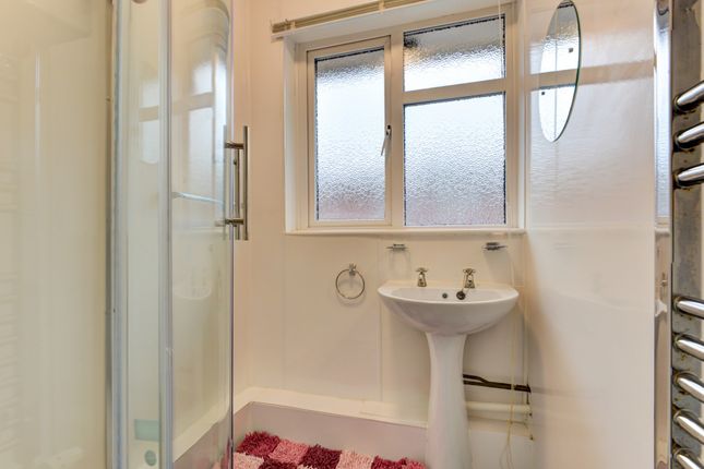 A Clean, Bright Bathroom Featuring A Large Window ...
