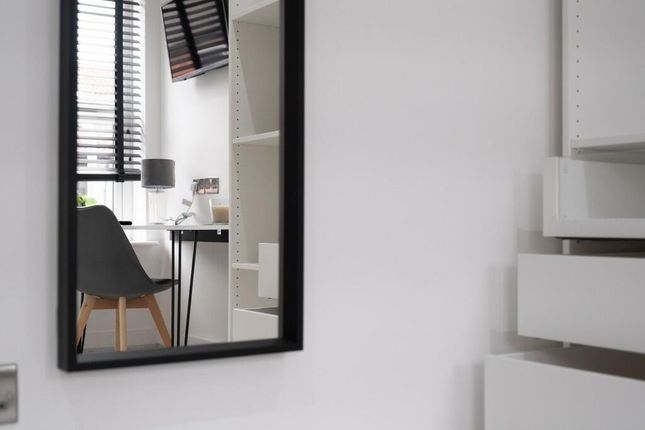 A Modern And Well-Lit Master Bedroom Features A La...