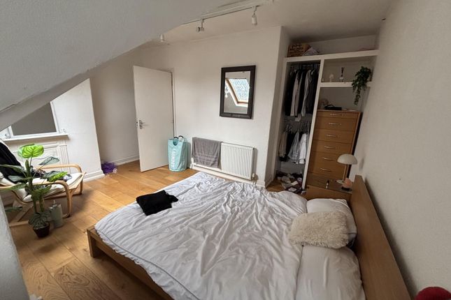 A Bright And Inviting Master Bedroom Featuring A l...