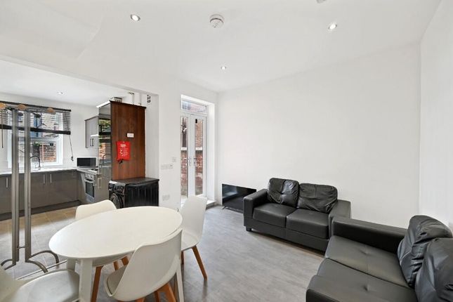 A Stylish And Modern Living Room Featuring Comfort...