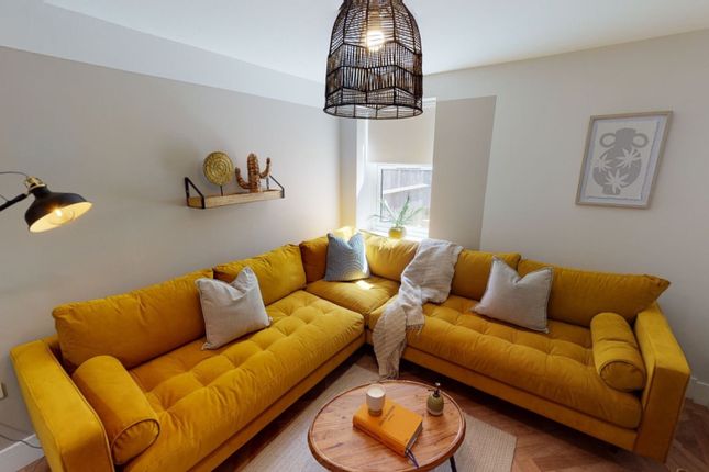 Bright And Stylish Living Room Featuring A Vibrant...