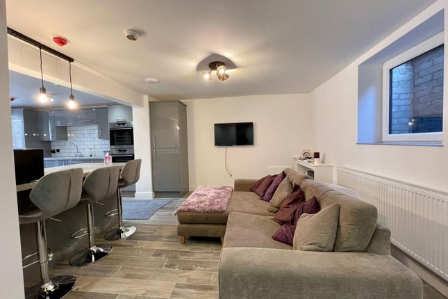 Spacious And Inviting Living Room Featuring A Comf...