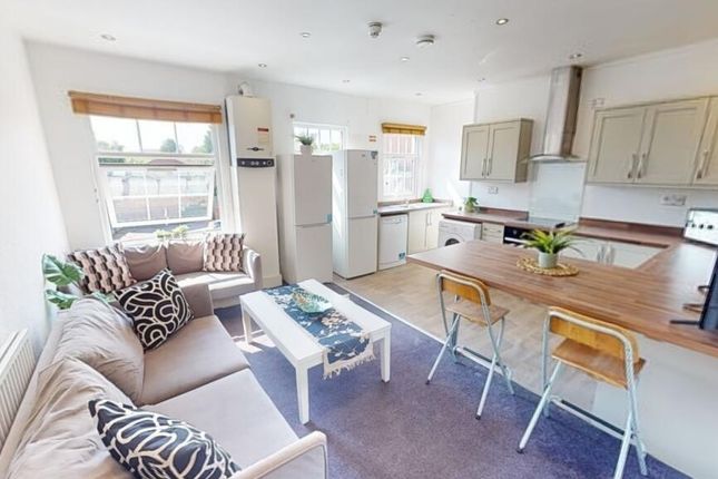 Bright And Welcoming Living Room With A Cozy Sofa,...